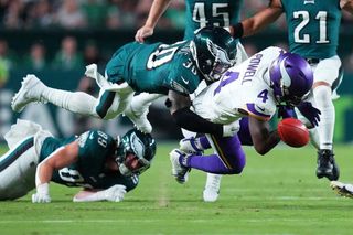 Brandon Powell #4 of the Minnesota Vikings fumbles the ball as he is tackled by Justin Evans #30 of the Philadelphia Eagles on a punt return during the first quarter at Lincoln Financial Field on September 14, 2023
