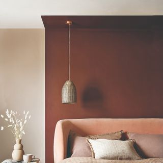 A bedroom with colour-blocked painted walls