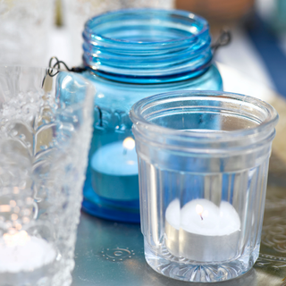 blue glass jar with candle glass jar
