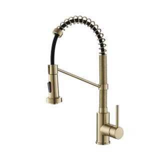 A curved gold kitchen faucet with a coiled faucet and a brushed gold handle