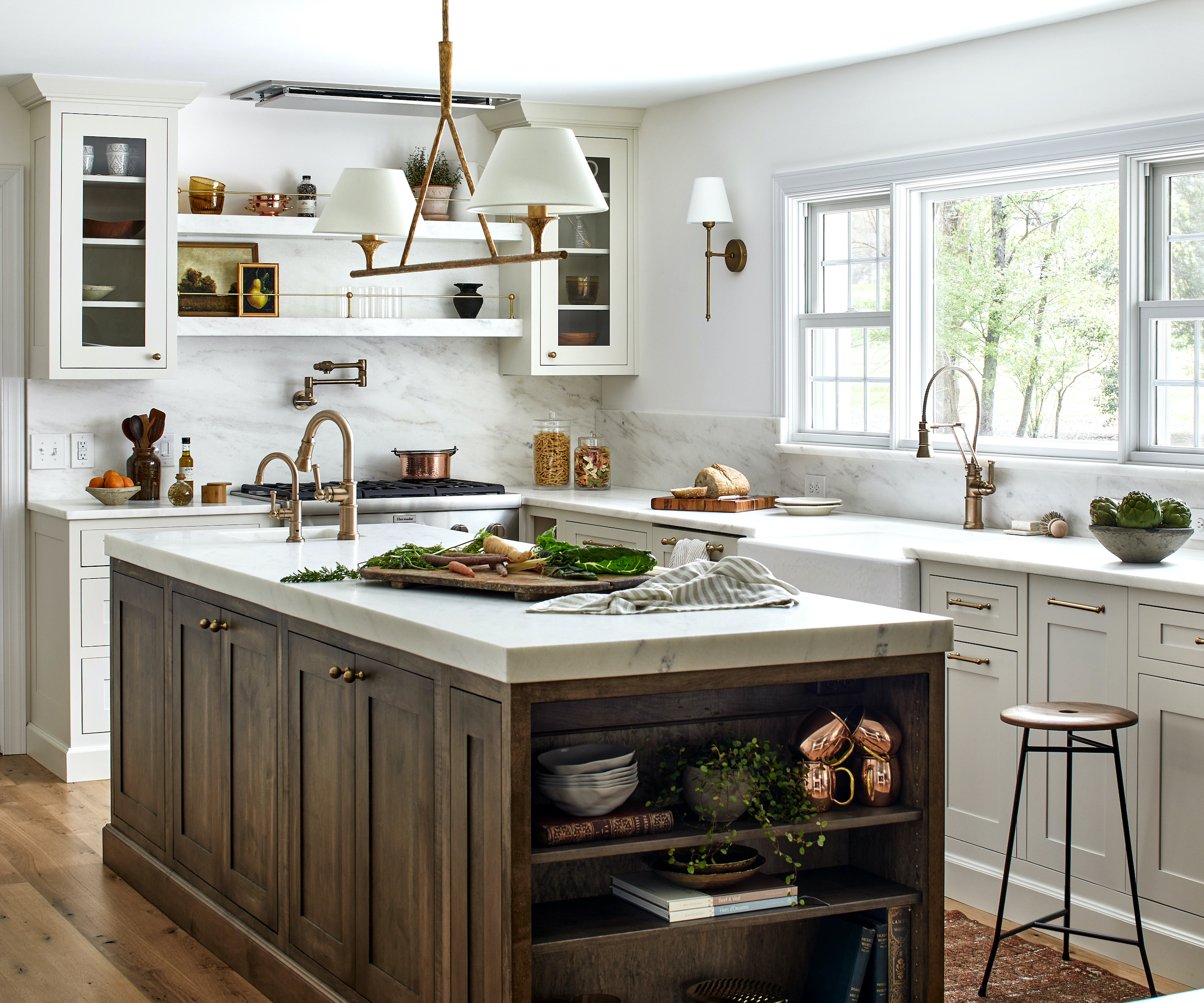 wood and white kitchen with marble counters and wood floors