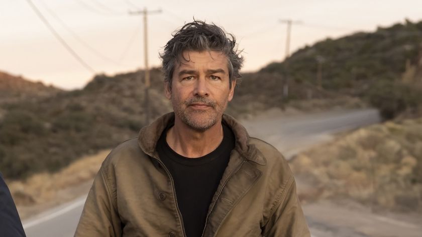 Kyle Chandler walking down a street in HBO's Lanterns