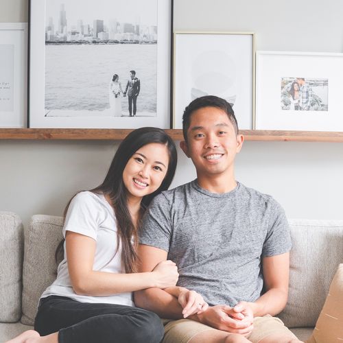 Vivianne Chow and her husband Tim on the couch