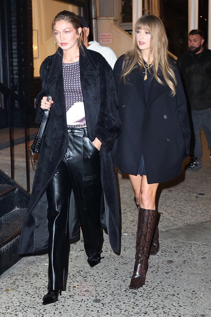 Gigi Hadid and Taylor Swift wearing black coats for a night out at Zero Bond in NYC