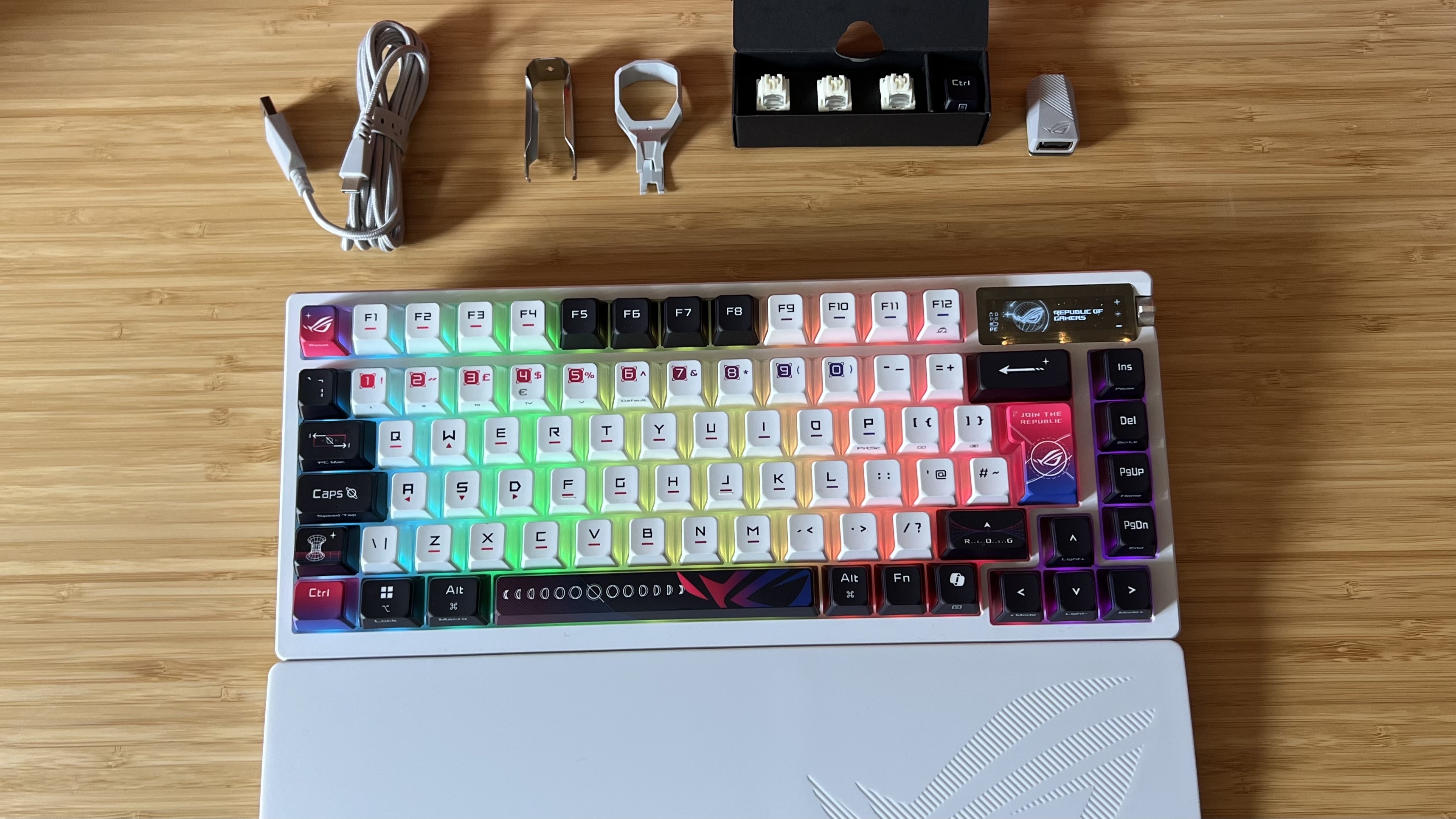 Asus ROG Azoth X with included switch and keycap puller and additional switches / cables