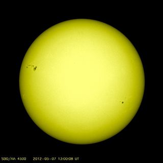 The monster sunspot AR1476 (top left) turns into view in this image from NASA's Solar Dynamics Observatory released on May 7, 2012.