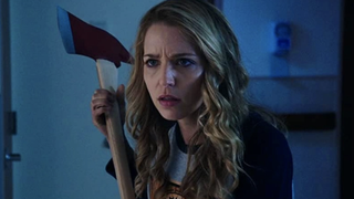 Jessica Rothe wielding an axe in Happy Death Day.