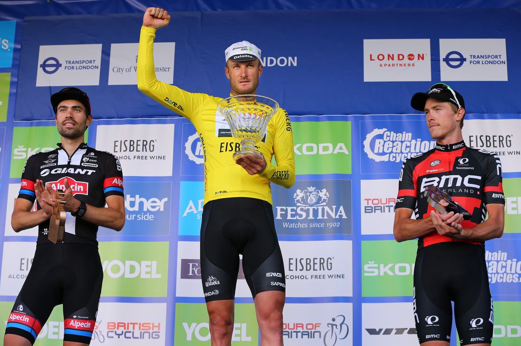 Steve Cummings (Dimension Data) on top step of the podium with his trophy