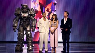 LOS ANGELES, CALIFORNIA - DECEMBER 07: Actors Aaron Moten, Ella Purnell, and Walton Goggins speak onstage during "Fallout" Cast and Creator at The Game Awards at Peacock Theater on December 07, 2023 in Los Angeles, California.