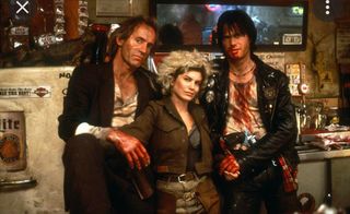 Lance Henriksen, Jenette Goldstein, and Bill Paxton as bloodied vampires in a bar in 'Near Dark'