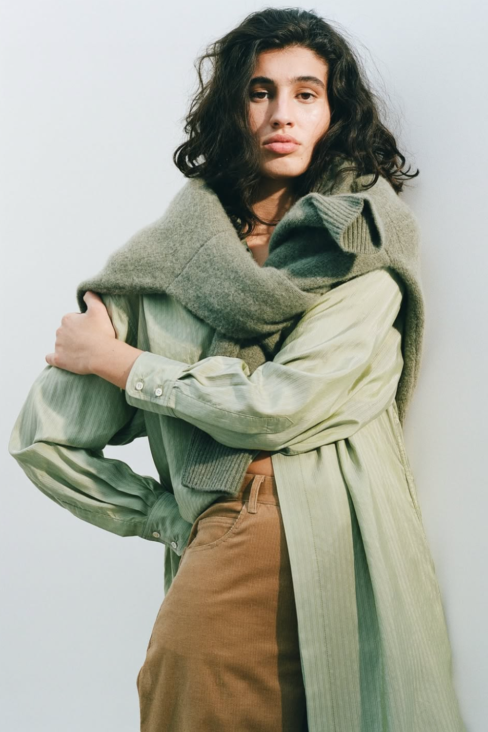 Le Kasha green shirt, brown trousers, jumper