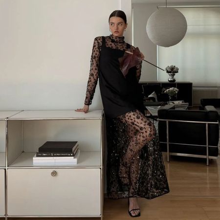 An image of @maryljean wearing a sheer cocktail dress.