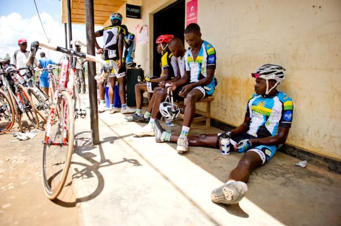 After the race finish, a Rwandan rider takes a rest