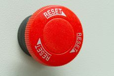 Red emergency stop and reset button.