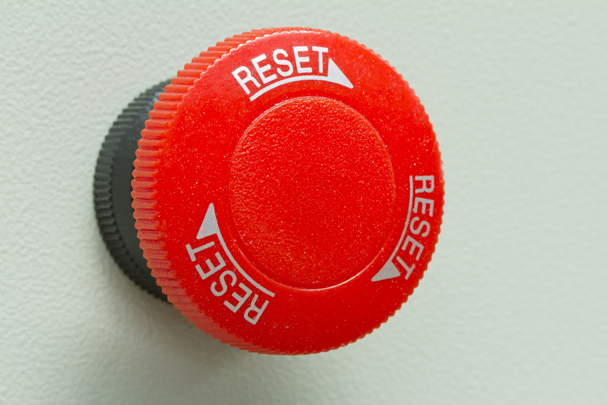 Red emergency stop and reset button.