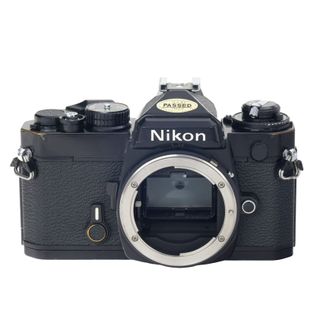 Nikon FE camera on a white background
