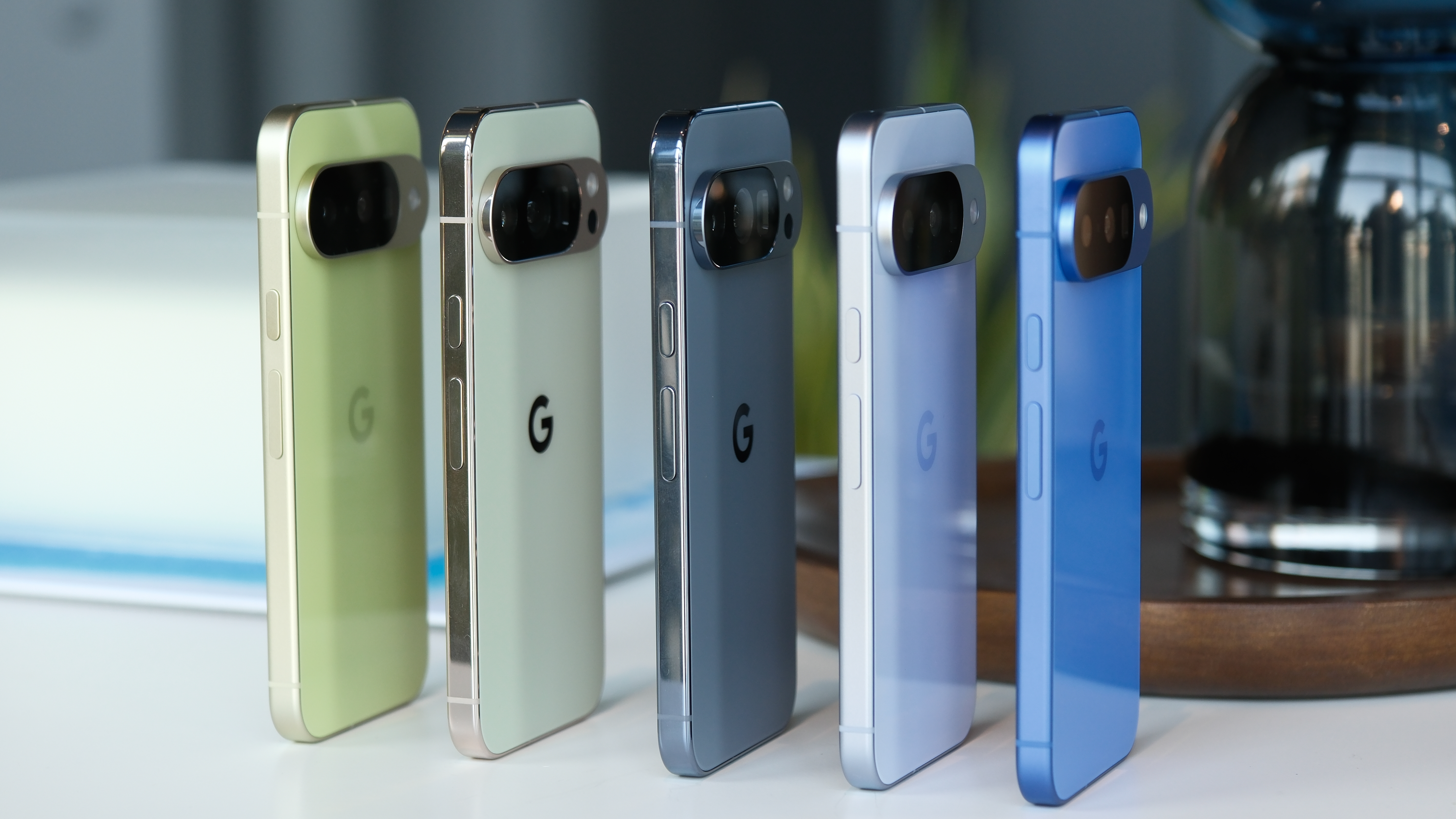 Multiple Pixel 10 and Pixel 10 Pro phones side by side from th eside showing color variations
