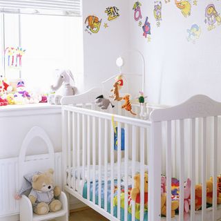 kids room with white cabin bed and soft toys