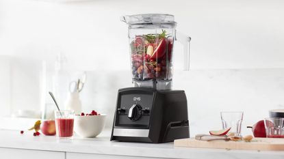 A Vitamix A2300 Blender maxing a berry smoothie