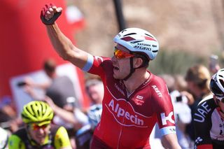 Alexander Kristoff raises his arm in celebration