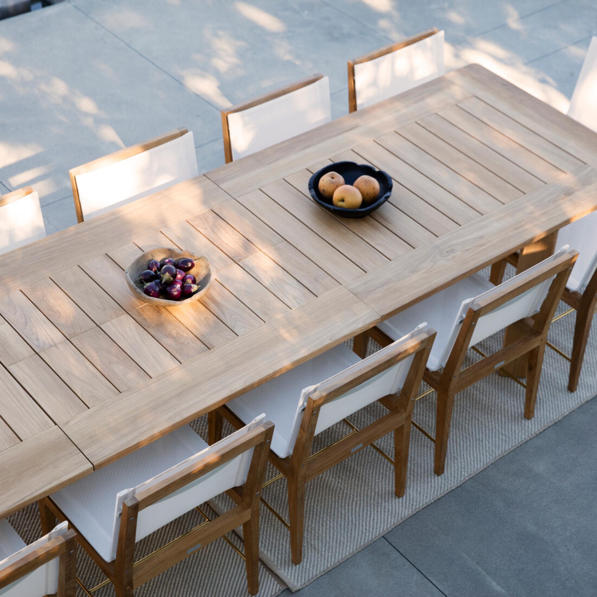 Andrew Martin Byron Extending Dining Table on a patio