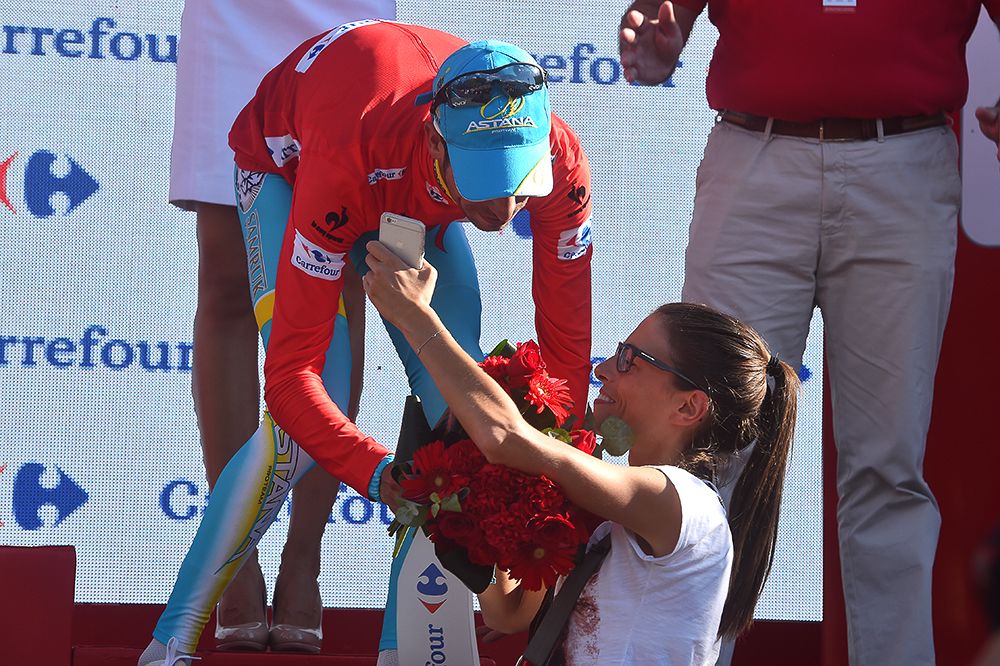 Fabio Aru celebrates on the stage 20 podium.