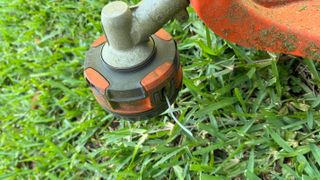 Husqvarna Combi Switch string trimmer head in grass