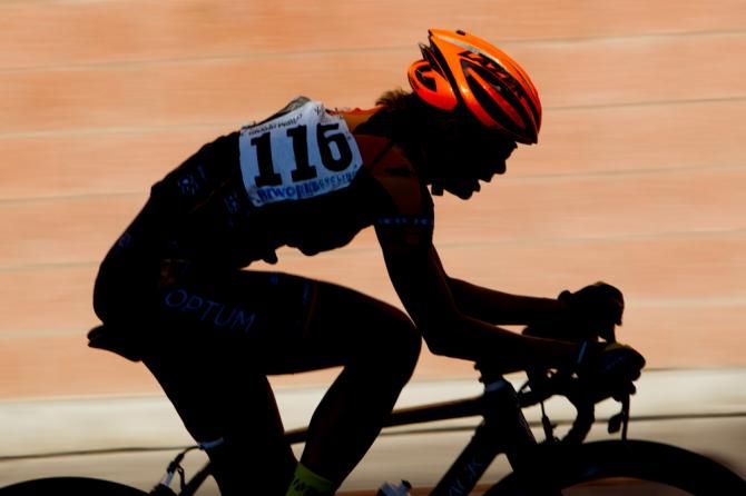 Lauren Hall (Optum) rides solo to lap the field.