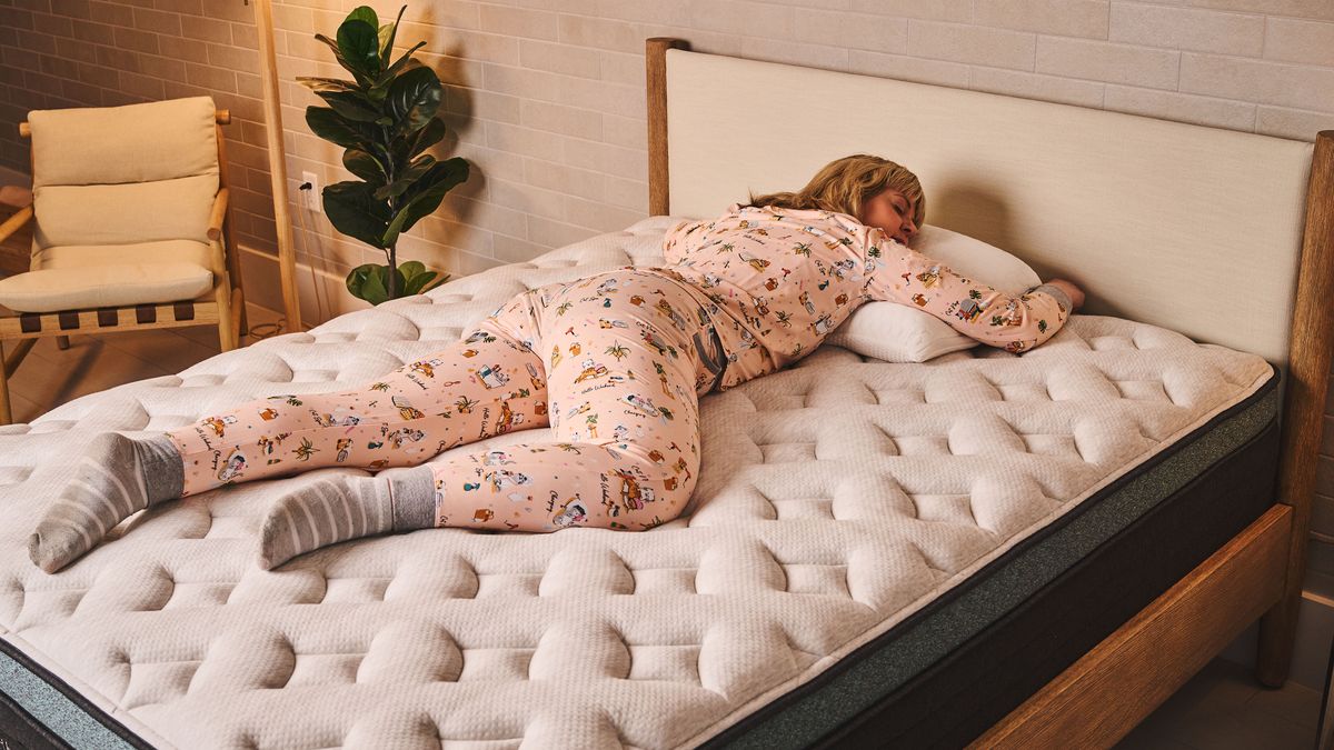 Our lead tester sleeps on her stomach on the Helix Sunset Luxe mattress