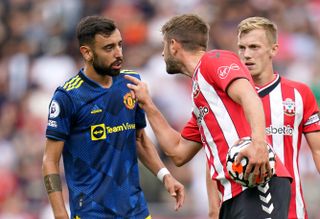 Southampton’s Jack Stephens (right) confronts Manchester United’s Bruno Fernandes during the Premier League match at St. Mary’s Stadium, Southampton. Picture date: Sunday August 22, 2021