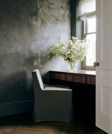 gray chair at a wooden desk