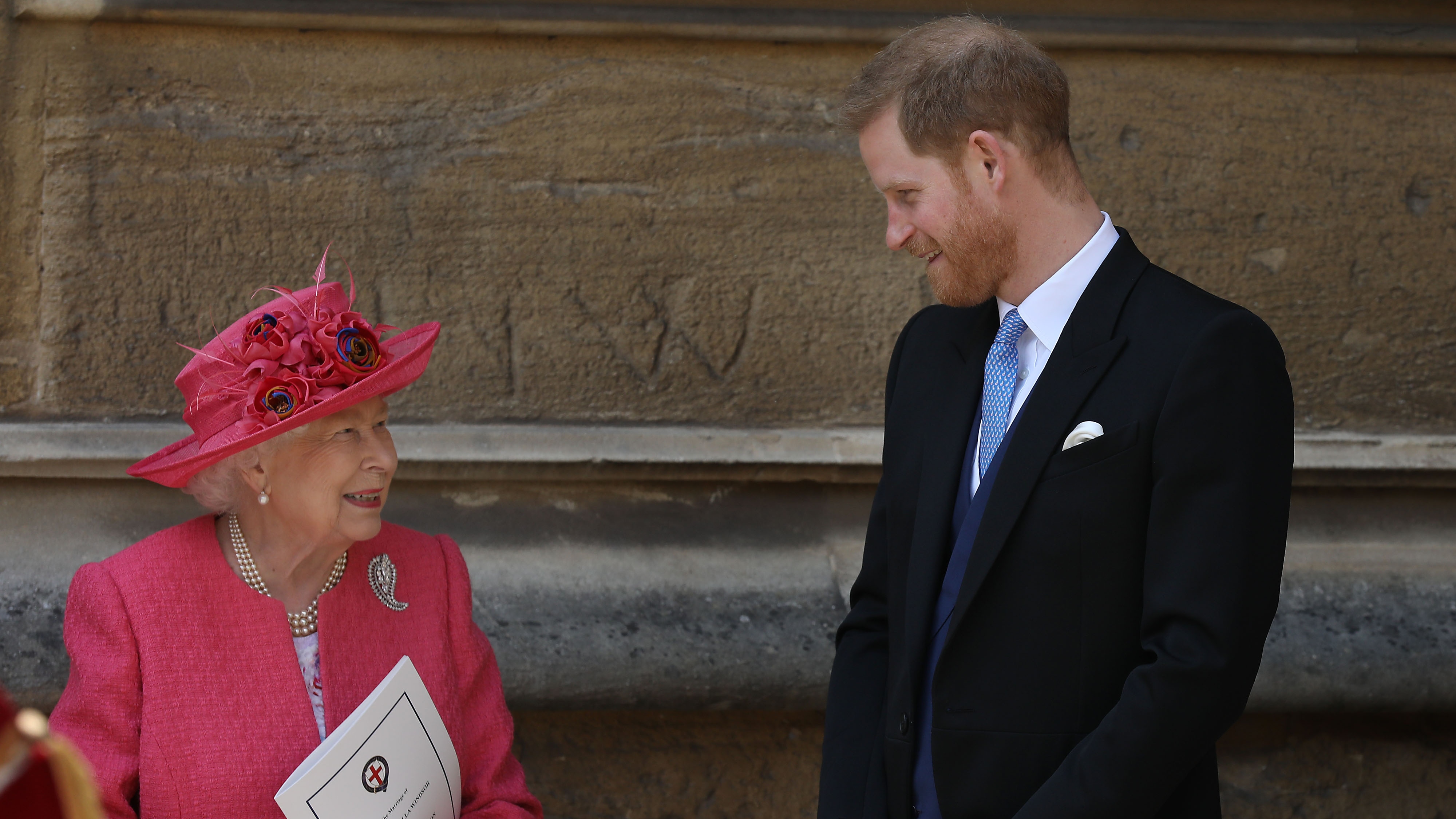 Queen Elizabeth II speaks with Prince Harry, Duke of Sussex as they leave after the wedding of Lady Gabriella Windsor to Thomas Kingston at St George&#039;s Chapel, Windsor Castle on May 18, 2019