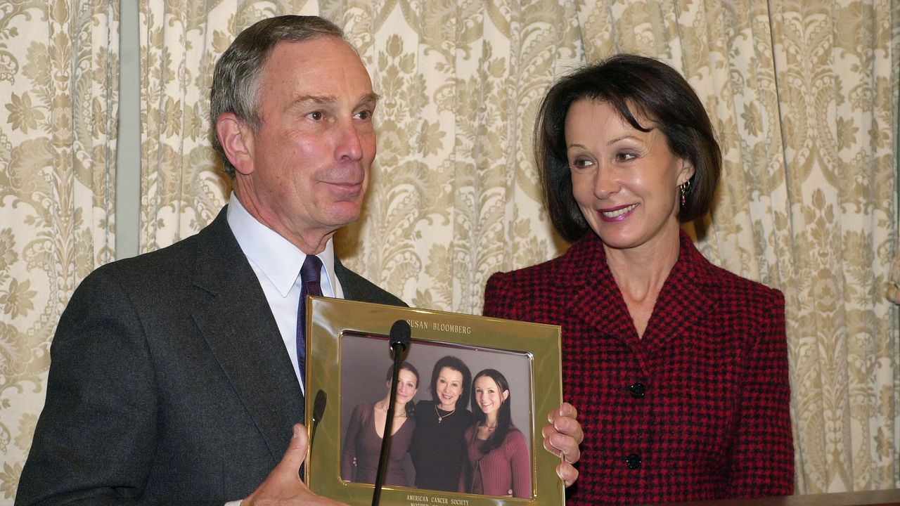 With his former wife, Susan Brown, smiling at his side, Mayo