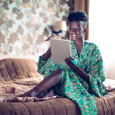 Lady playing on tablet