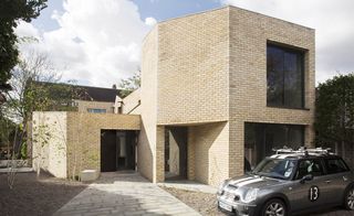 Luker House - a yellow modern brick building with large black framed windows