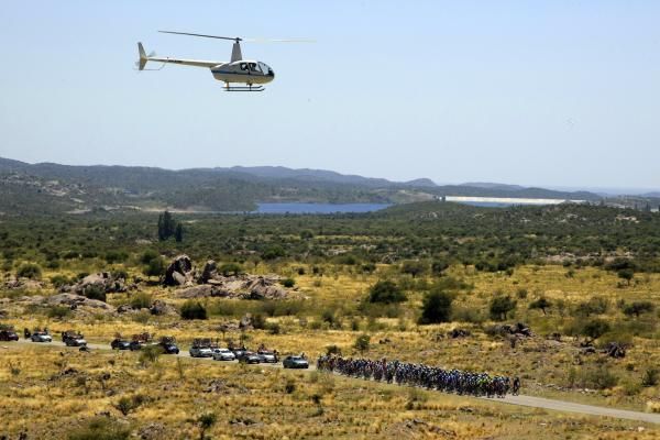 A helicopter captures action from above.