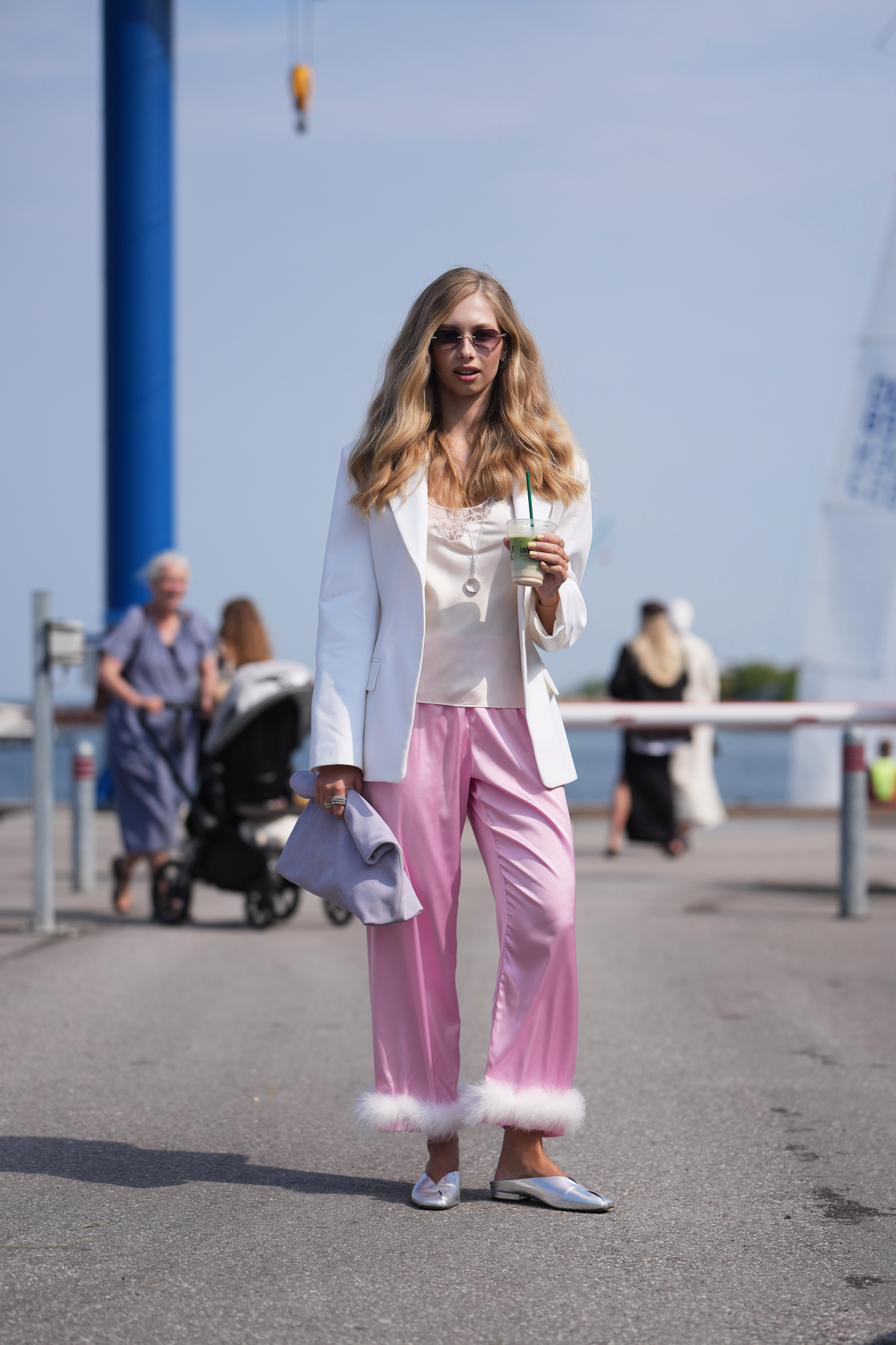 A guest wore the white lace top trend at Copenhagen Fashion Week