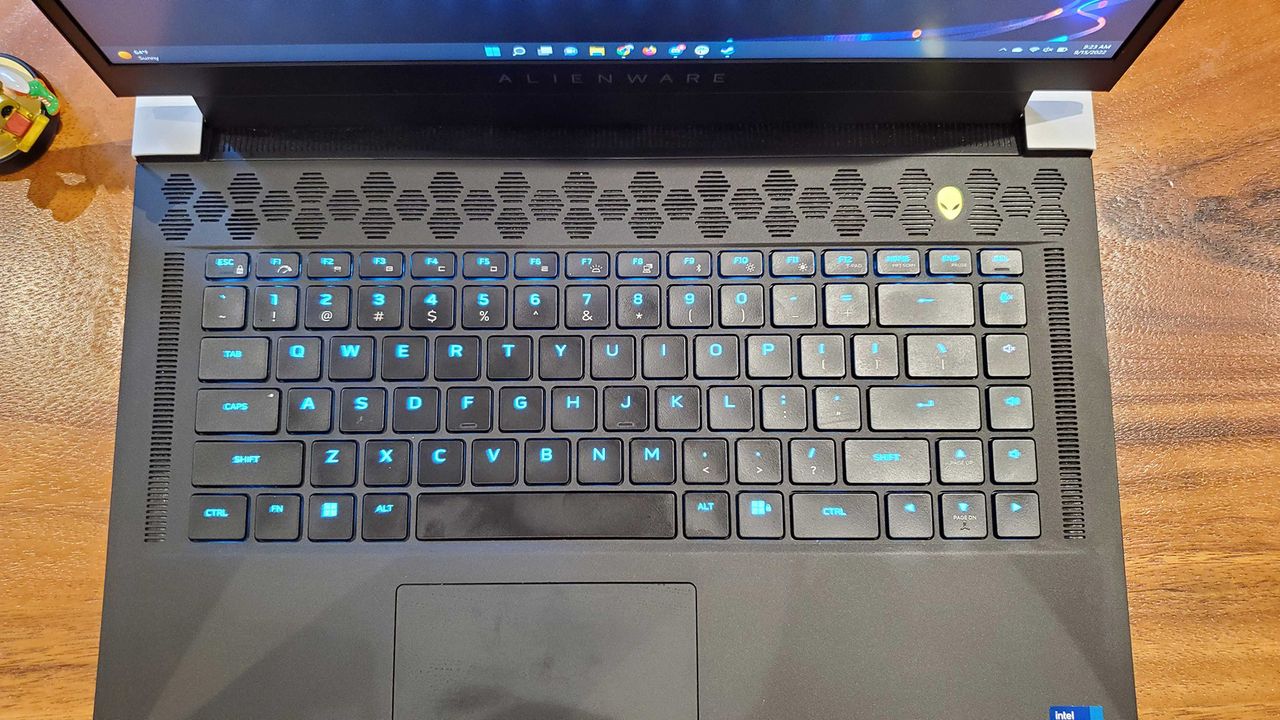 An Alienware x15 R2 gaming laptop on a wooden table