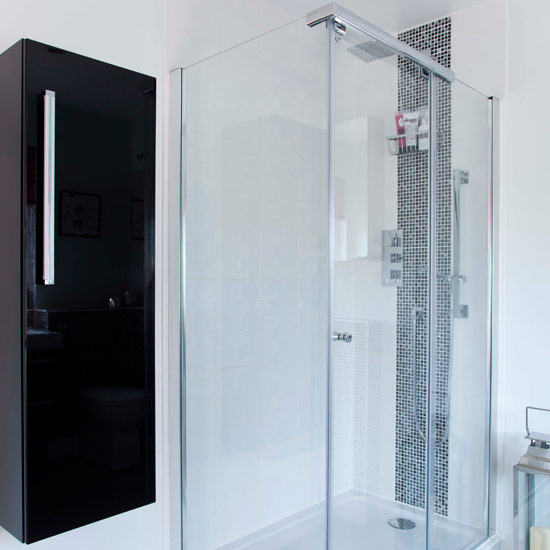 shower head with mosaic tiles white wall