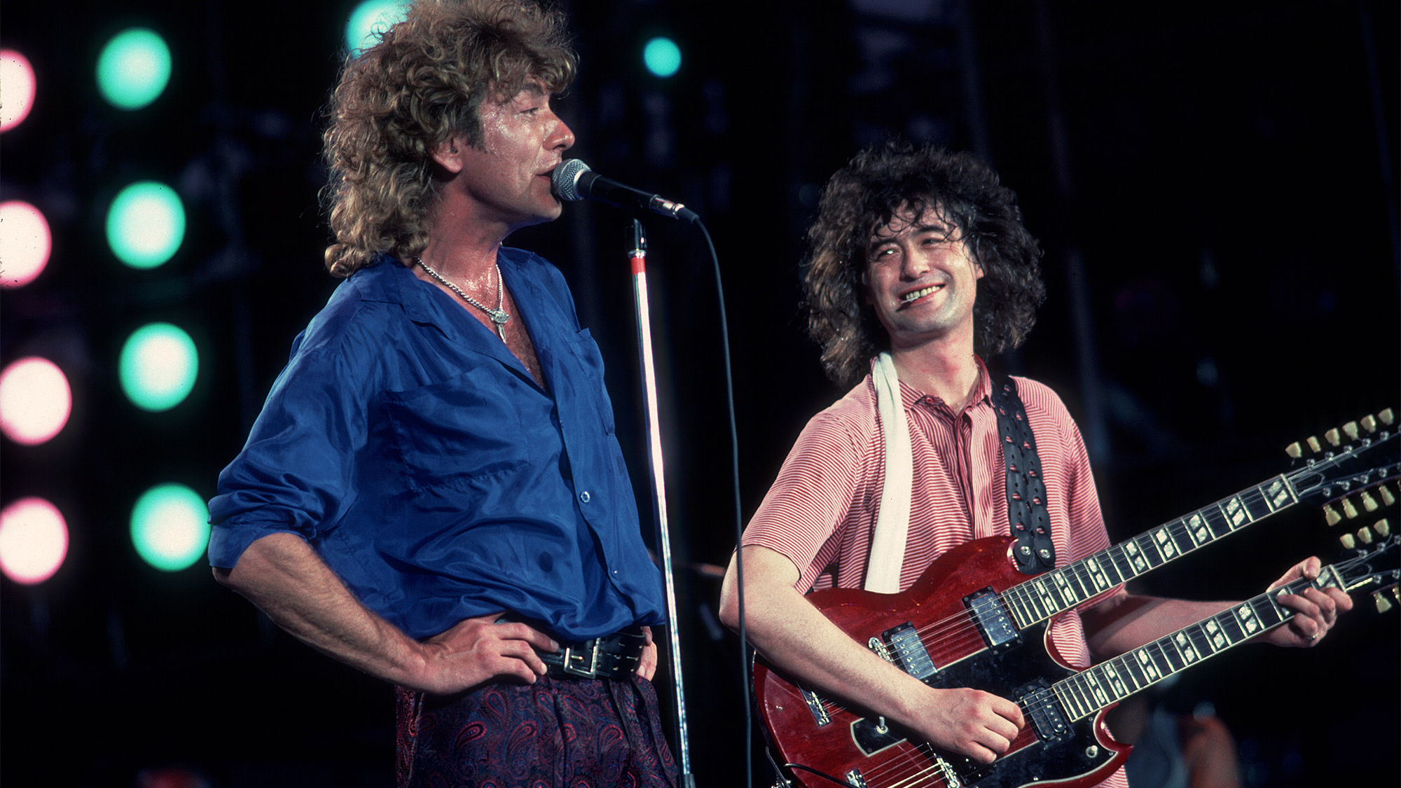 Robert Plant, left, and Jimmy Page, right, of Led Zeppelin perform at Live Aid at Veteran's Stadium in Philadelphia, Pennsylvania, July 13, 1985.