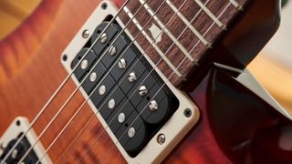 Close up of the upper frets and neck pickup of the PRS Custom 24