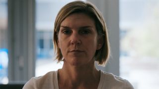 A close up of an unimpressed Carol in Pluribus episode 3