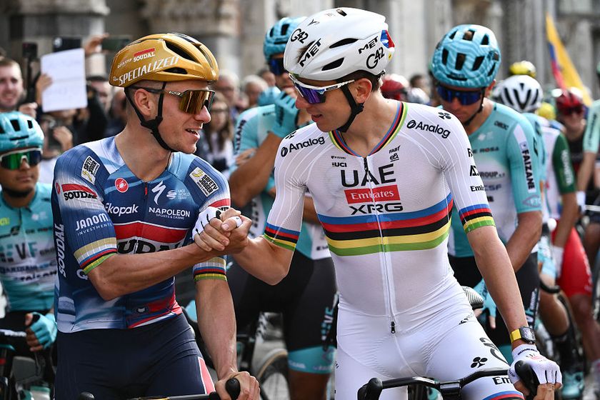 Soudal Quick-Step’s Belgian rider Remco Evenepoel (L) speaks with UAE Team Emirates’s Slovenian rider Tadej Pogacar (R) ahead of the 119th edition of the Giro di Lombardia (Tour of Lombardy), a 238km cycling race from Como to Bergamo on October 11, 2025. (Photo by Marco BERTORELLO / AFP)