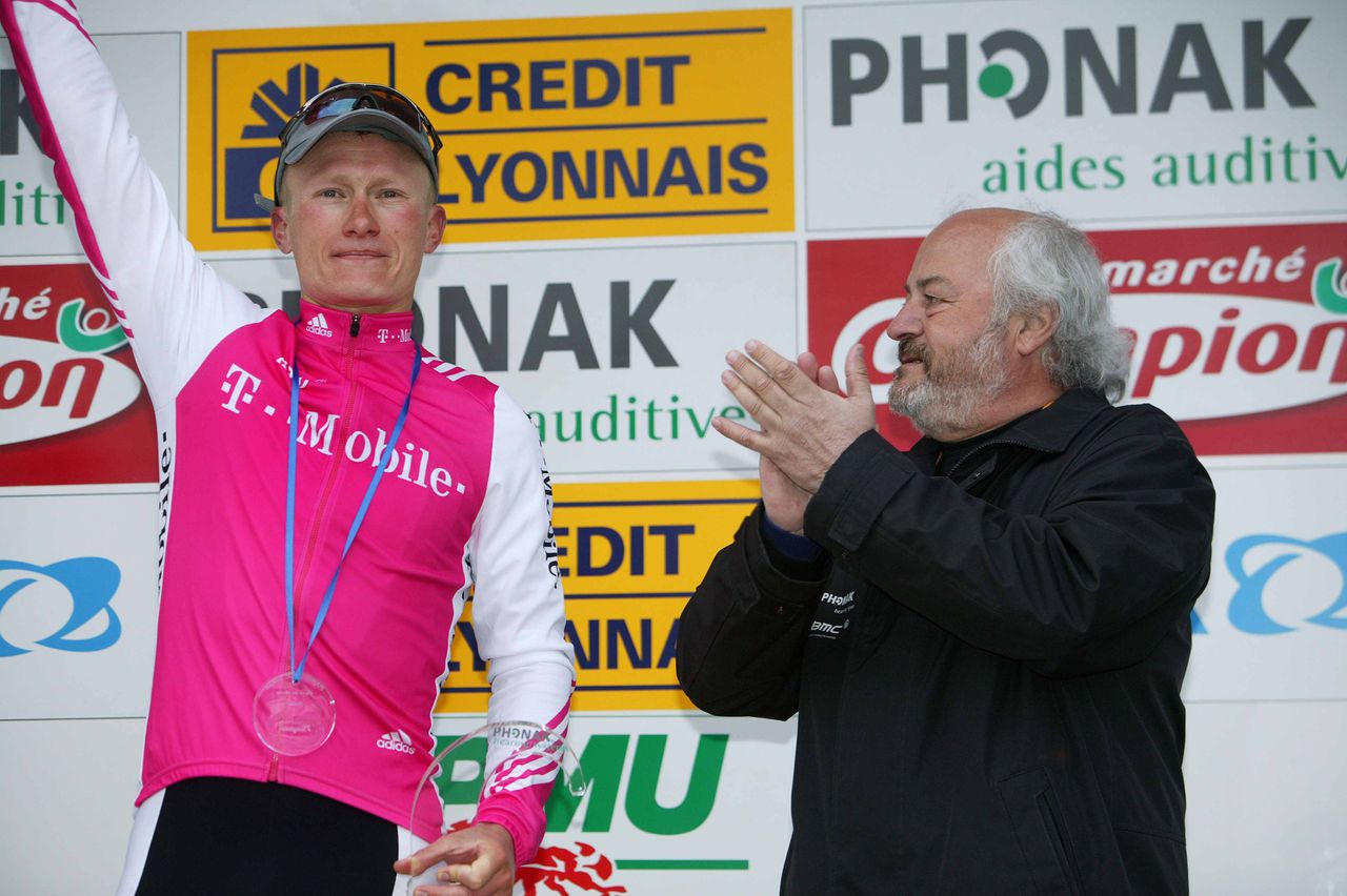 BMC owner Andy Rihs applauds Alexander Vinokourov in Cannes at Paris-Nice in 2004.