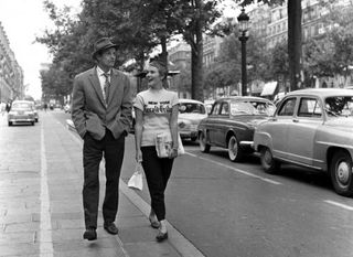 Breathless - Jean Paul Belmondo & Jean Seberg stroll down the Champs ElysÃ©es in Jean-Luc Godardâ€™s classic film. Copyright Raymond Cauchetier, courtesy James Hyman Gallery.