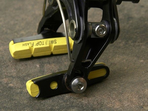 Pad slots are intentionally short to maintain compact dimensions and maximize stiffness.