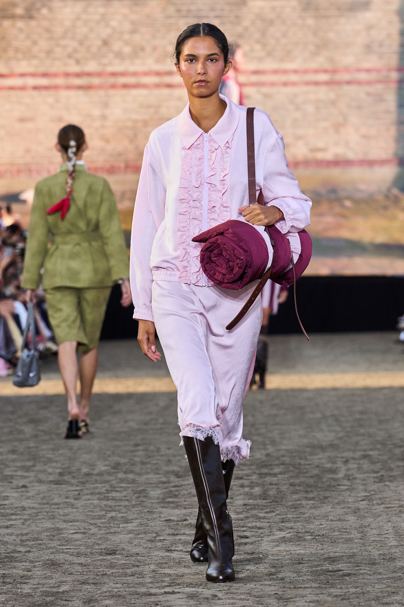 Baum Und Pferdgarten model wearing riding boots.