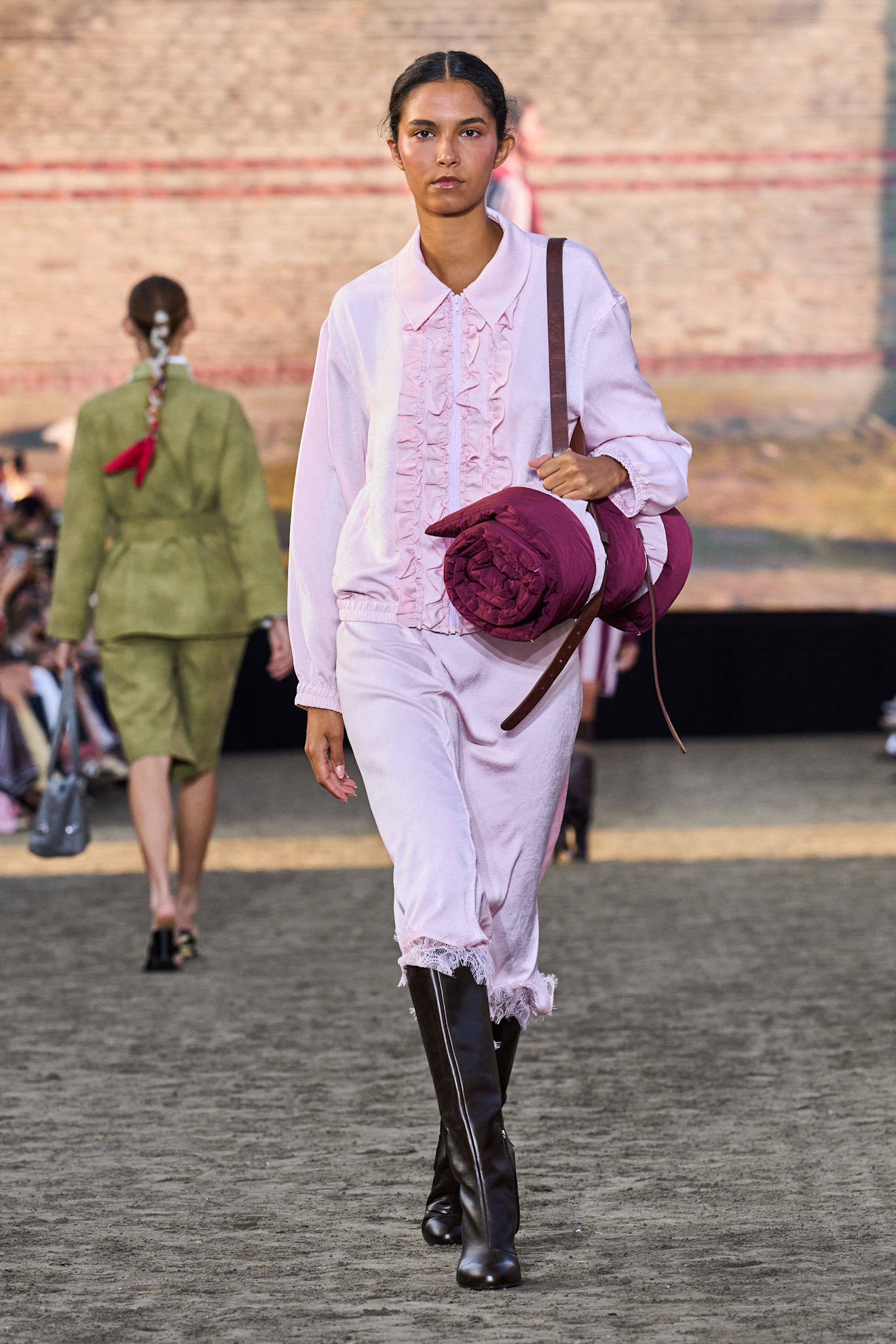 Baum Und Pferdgarten model wearing riding boots.