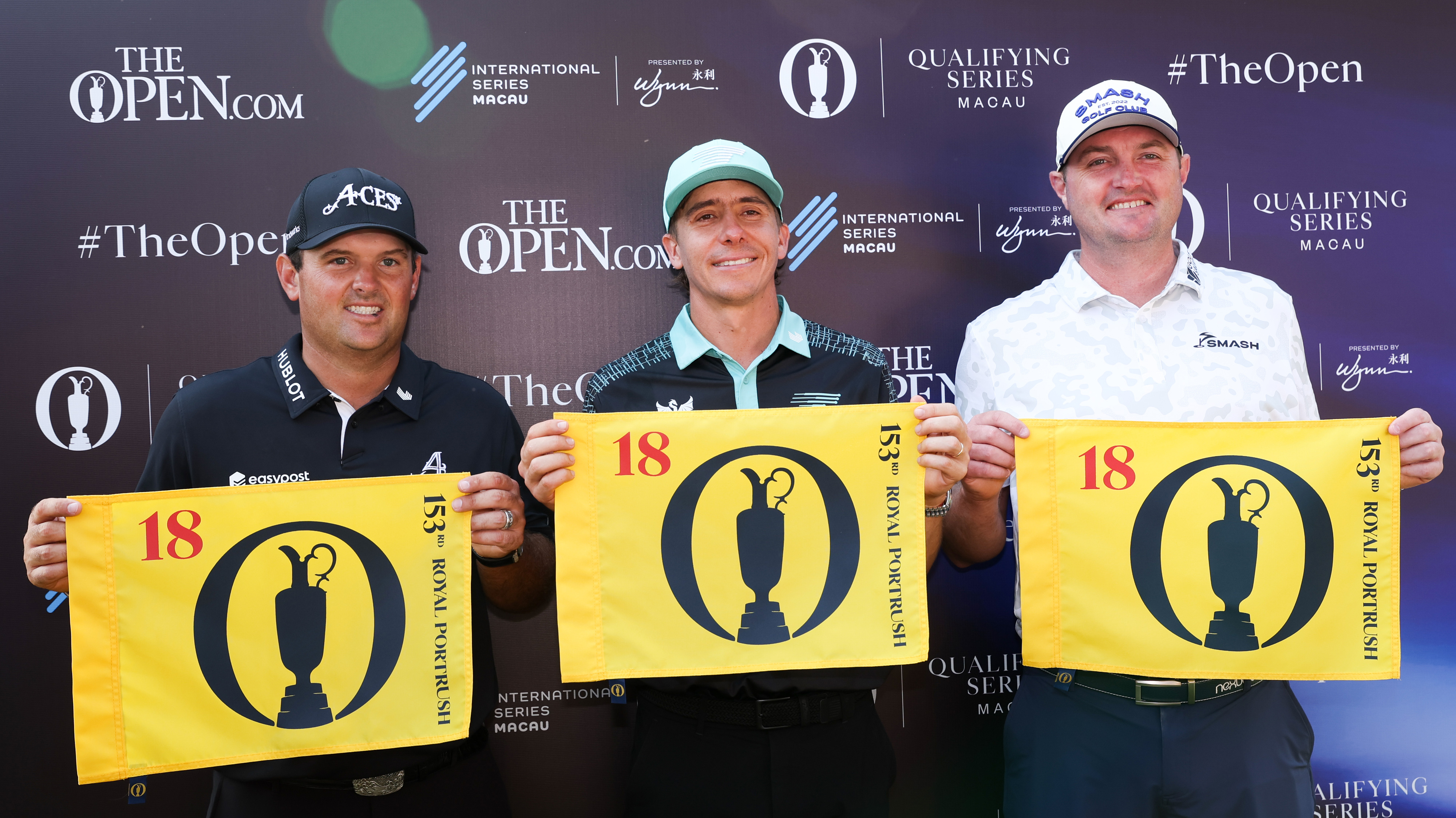 (L to R) Patrick Reed, Carlos Ortiz and Jason Kokrak all hold up Open Championship pin flags after earning their spot at the 153rd Open