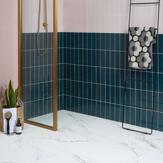 bathroom with white marble flooring potted plant and cleaning brush